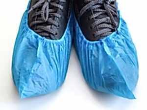 blue shoe covers over shoes