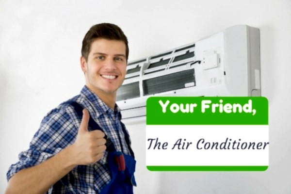 Man in overalls giving thumbs up next to wall-mounted HVAC system