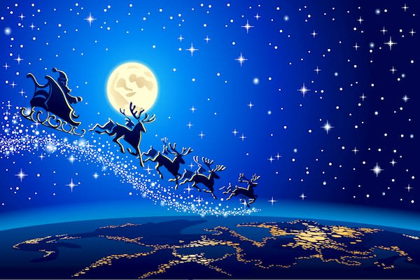 Santa, sleigh, and reindeer flying high over the earth in blue night's sky, with lights from city beneath them and moon overhead