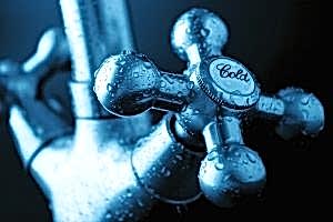 'Cold' faucet covered in condensation