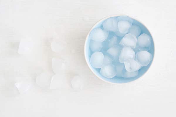 Putting ice water in front of a fan will cool down a room