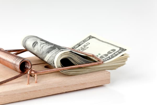 Mouse trap affixed with a wad of cash
