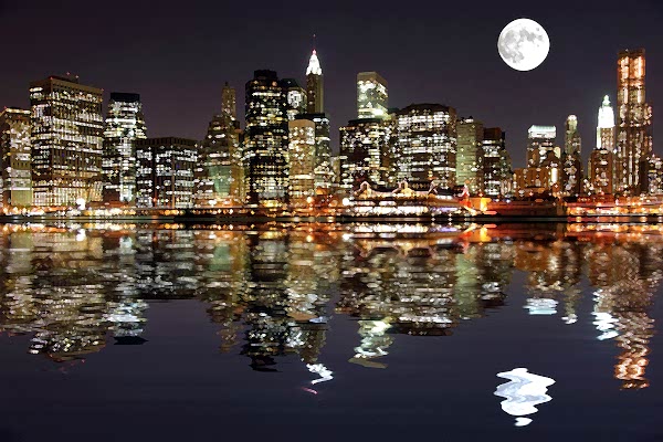 Shot of New York skyline at night as seen from the Hudson river. Featuring Cosmo's Moon.