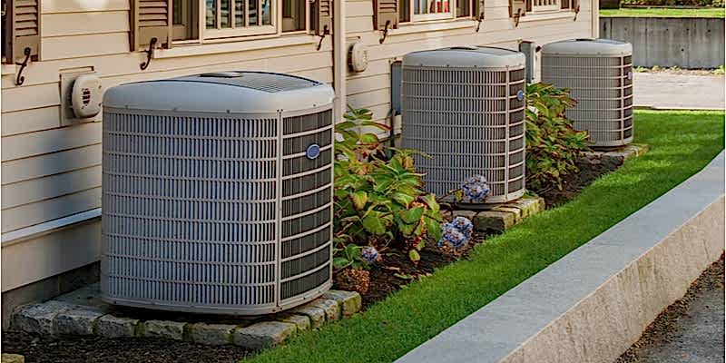 AC units in a row outside a home