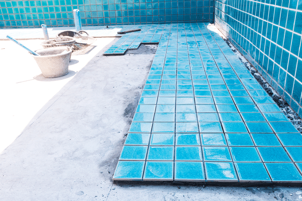 In-progress inground pool installation in the backyard of a Los Angeles home.