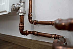 Copper pipes in a bathroom. How can I make my pipes last longer?