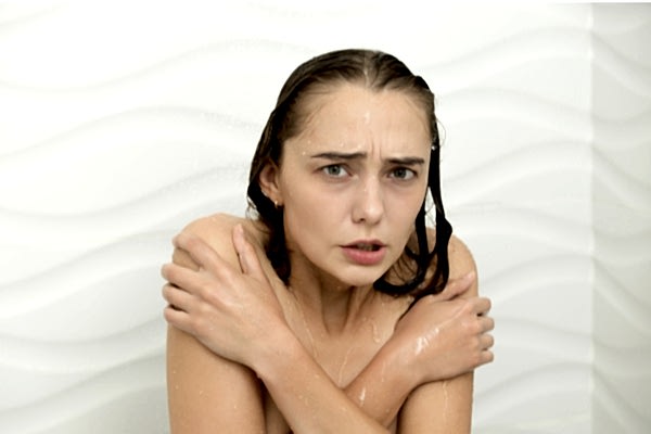 Woman running out of hot water before the end of her shower