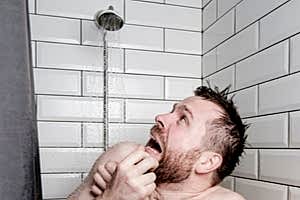 Man running out of hot water during a shower