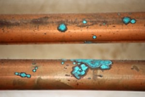 Signs of pinhole leak in copper pipe - oxidation of copper pipe