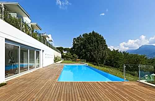 An inground pool landscaped for a hilly back yard.